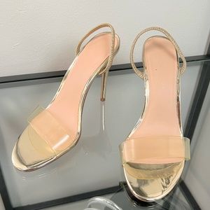 Clear strapped gold heels